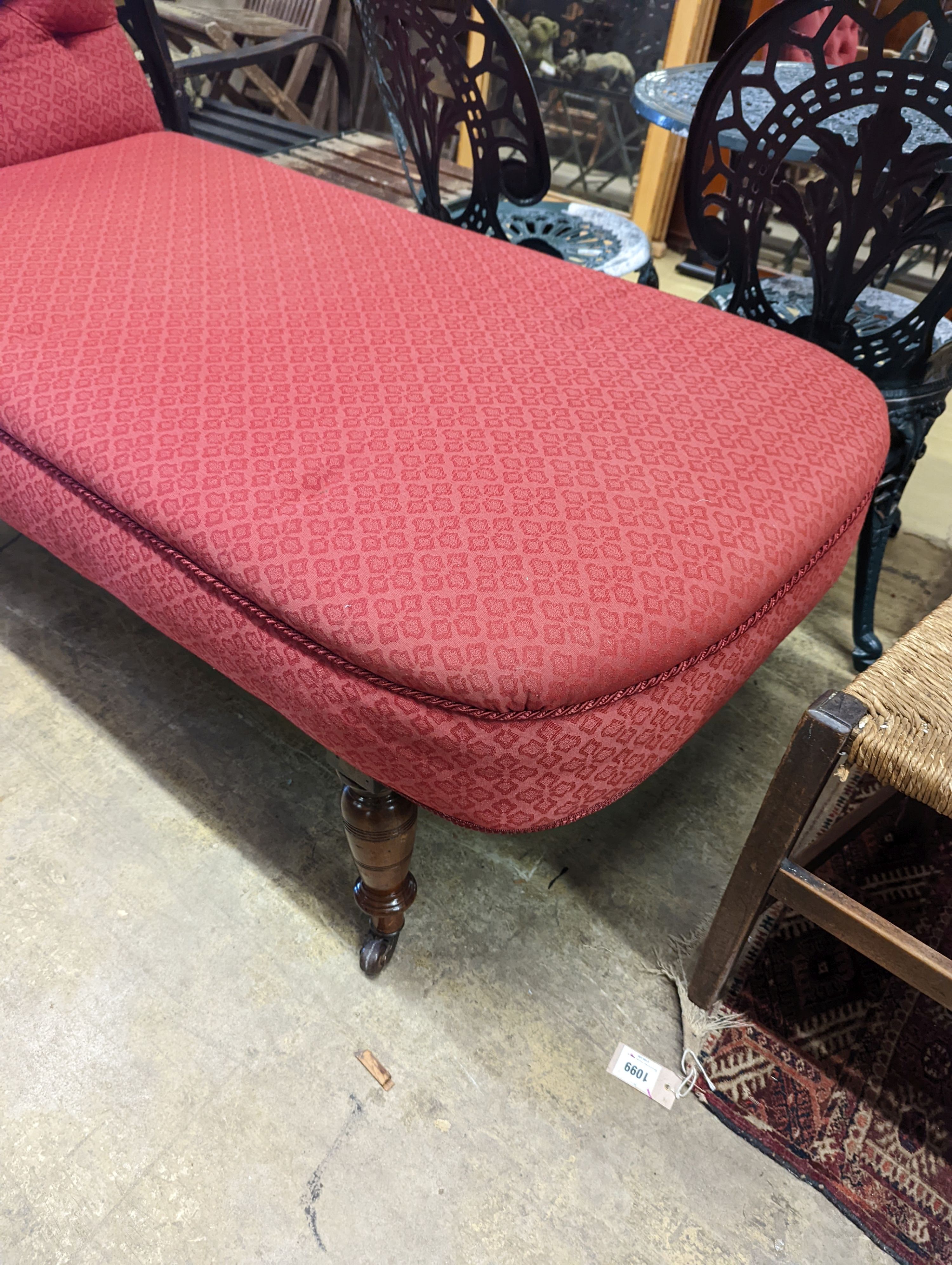A Victorian mahogany drop arm daybed upholstered in buttoned red fabric, length 160cm, depth 70cm, height 96cm